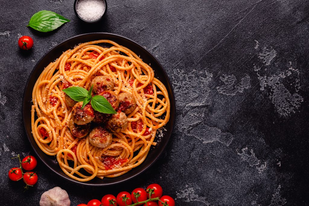 Spaghetti with meatballs and tomato sauce and other ingredients